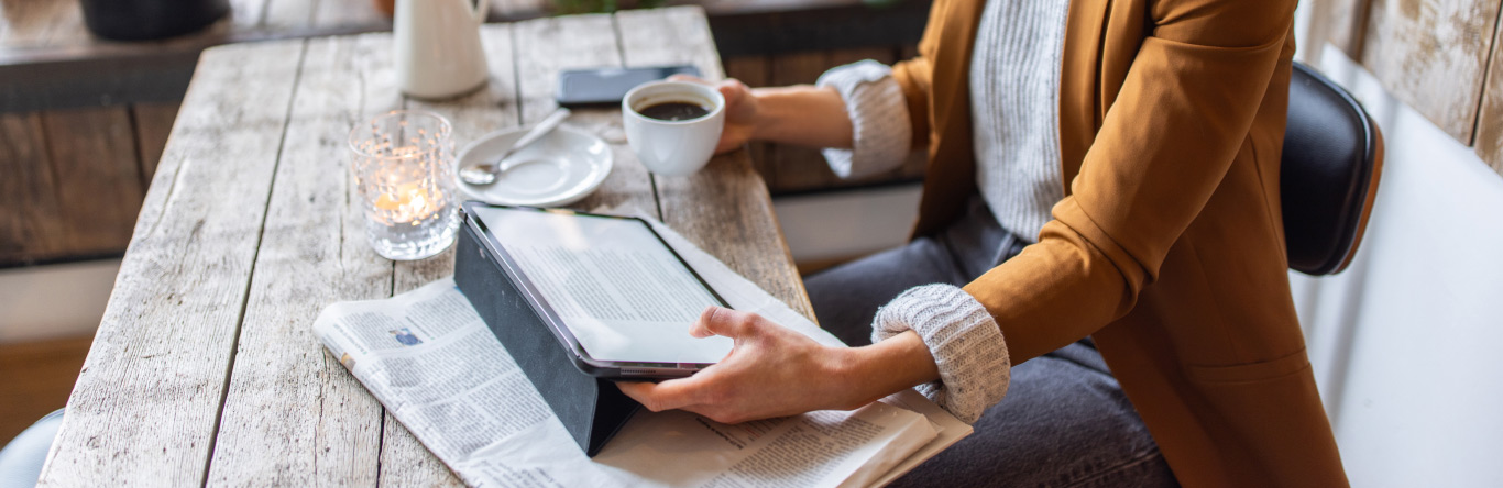 Person using tablet with Real Source app opened